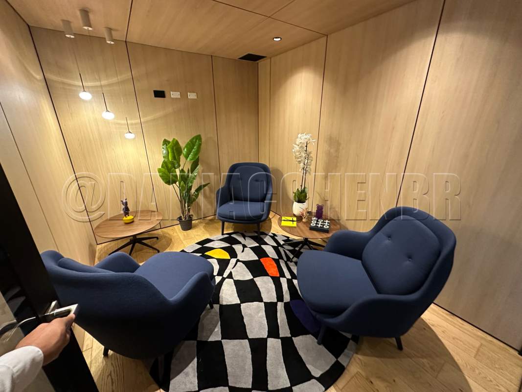 Modern eclectic bathroom with patterned tile wall toilet sink inside commercial tower Panama City