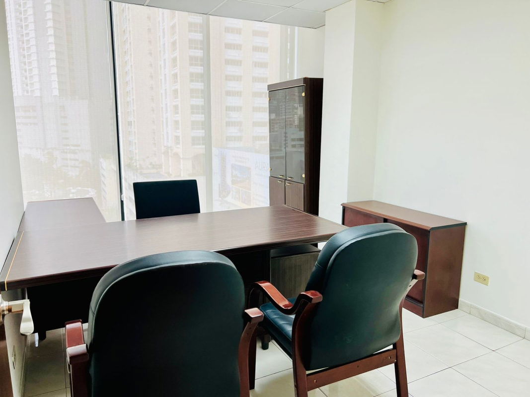 Modern commercial tower with blue reflective glass exterior PH Omega Obarrio Panama City