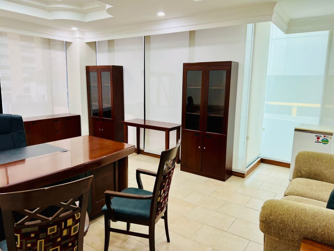Private office room with wooden furniture large windows PH Omega Obarrio Panama