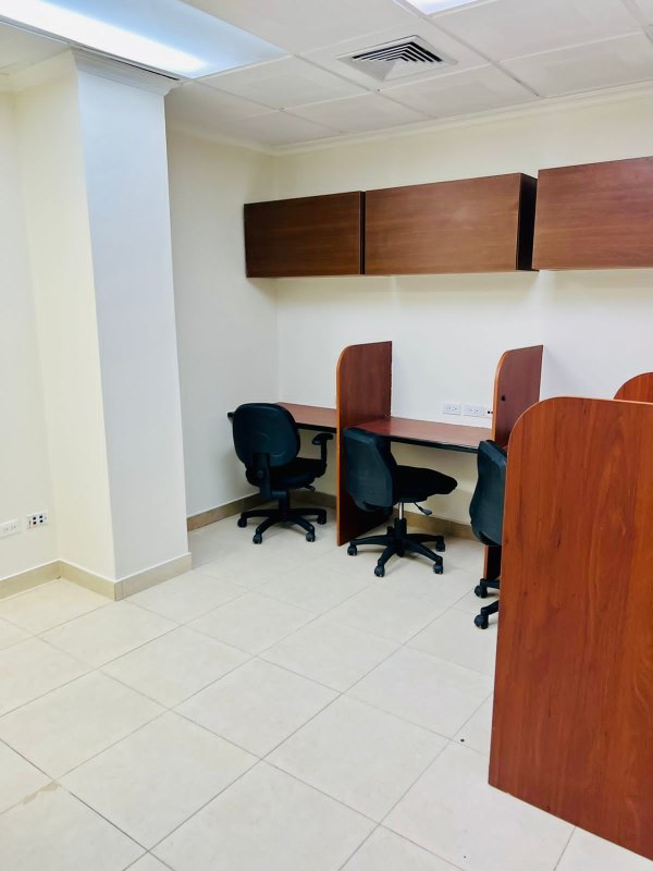 Meeting room with wooden table black leather chairs PH Omega Panama City