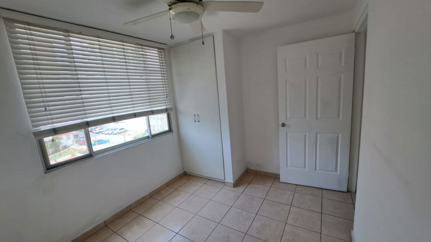 Empty bedroom with ceiling fan, blinds, tile floor PH Altos de la Colina Panama apartment