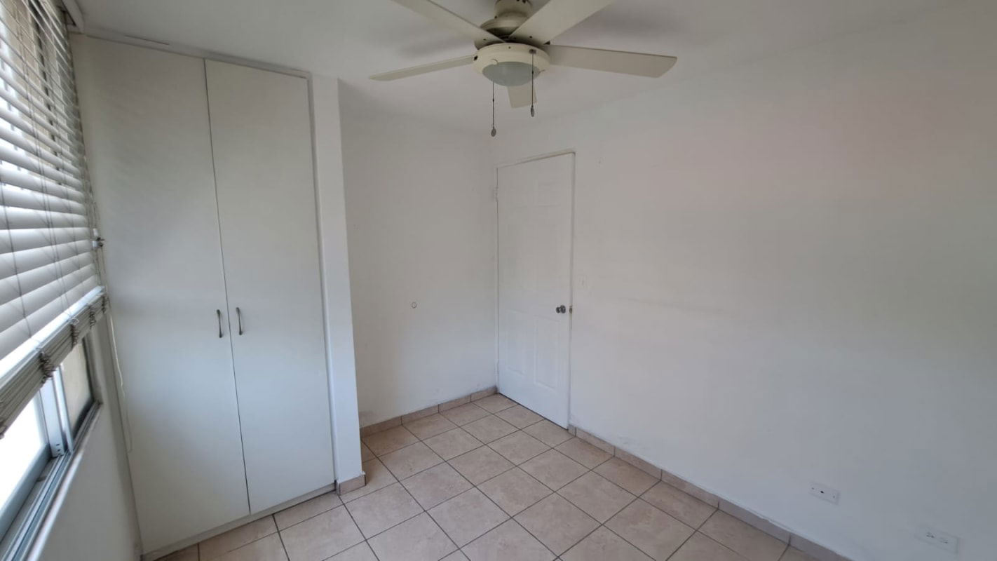 Bedroom with tile floors, ceiling fan, built-in closet at PH Altos de la Colina Panama City