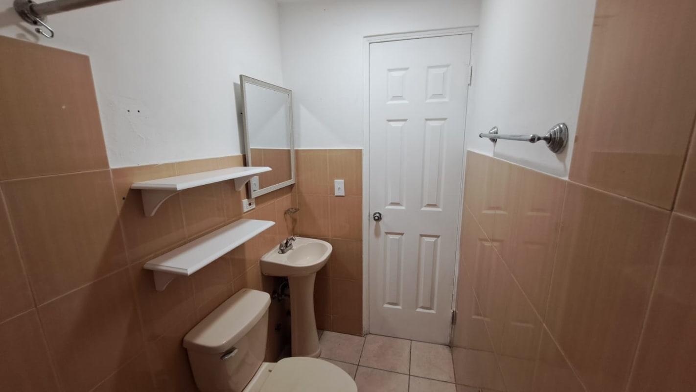 Spacious lobby with seating and glass doors PH Altos de la Colina 12 de Octubre Panama City