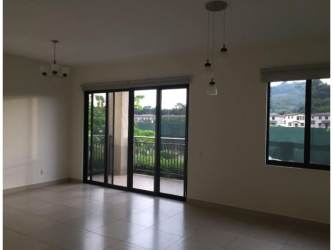 Bedroom with built-in closet, split AC, and lush garden view PH River Valley Panama Pacifico