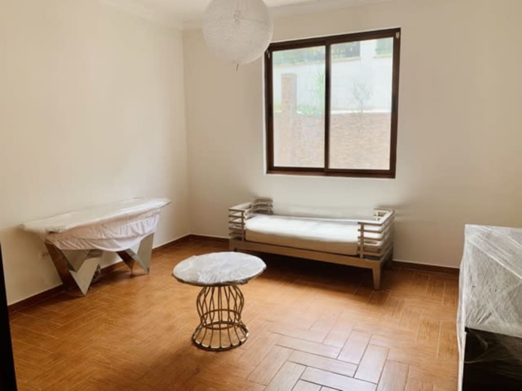 Home office study room with tile floors and window in house Clayton Panama