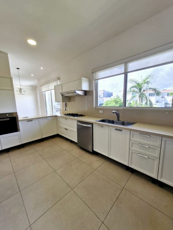 Luxury master bath with double sink marble vanity, bathtub and glass shower enclosure at The Reserve Santa María Panama