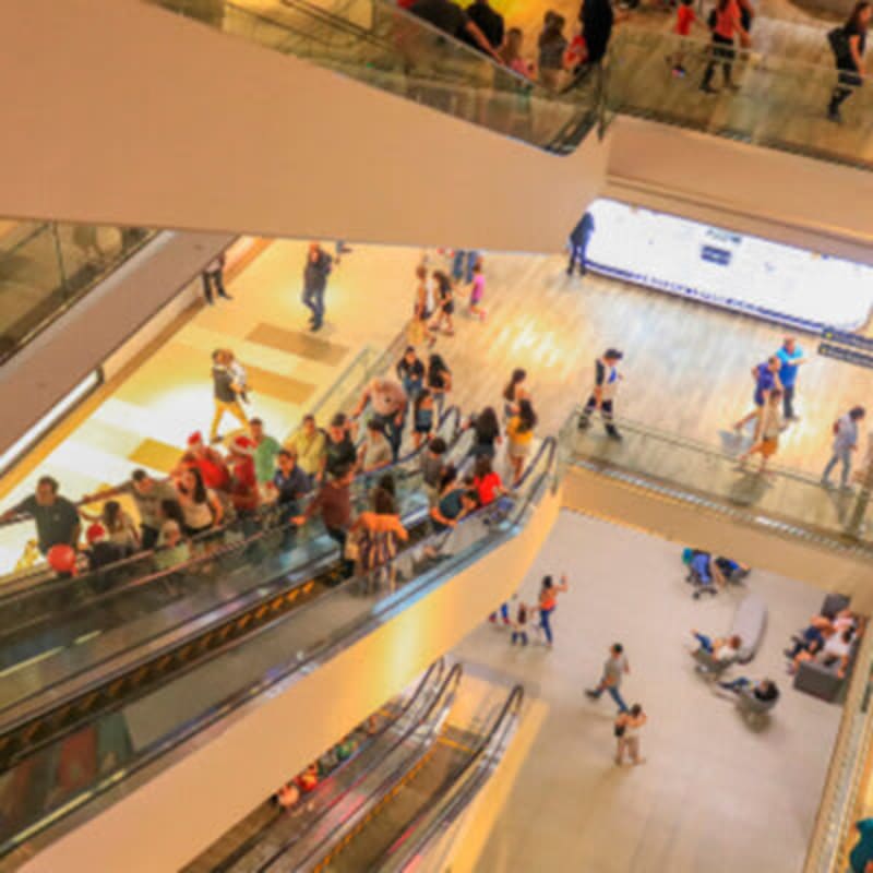 Multi-story shopping mall atrium with glass balconies shops Town Center Costa del Este Panama