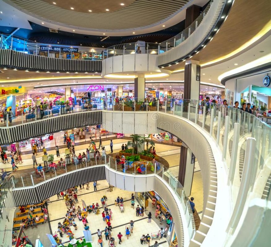 View from upper level inside shopping mall glass railings Town Center Panama