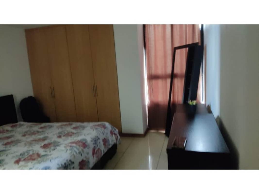 Bedroom with floral bedspread, wood wardrobe, mirror, Terrazas del Rey Condado del Rey Panama