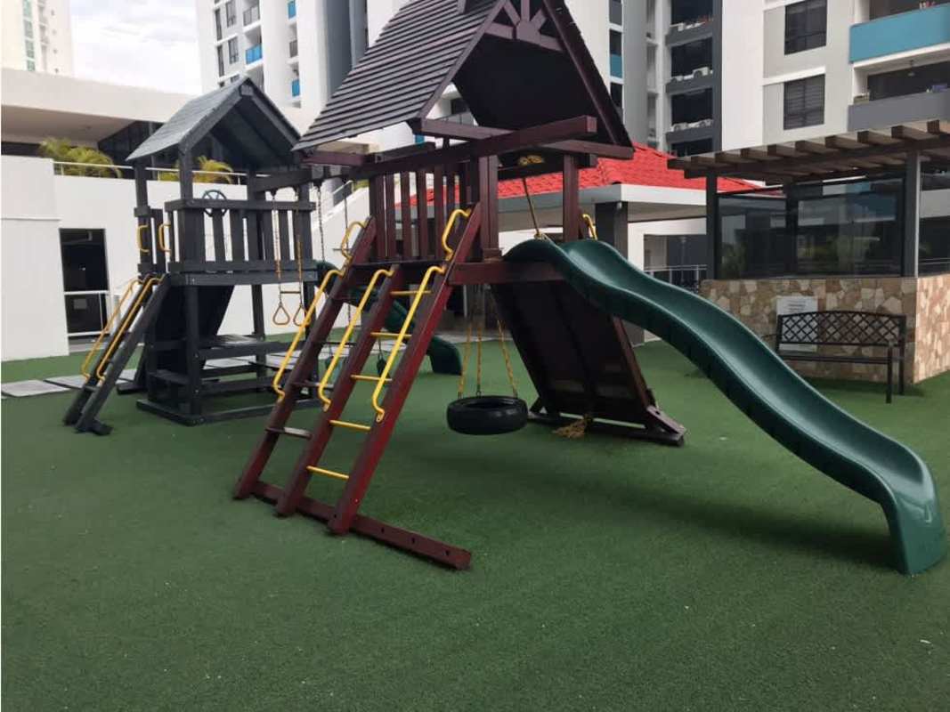 Outdoor playground with slide and artificial grass Terrazas del Rey Panama