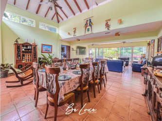 Open living dining area with vaulted ceilings, garden views, tile flooring in Decameron Beach Villas Panama