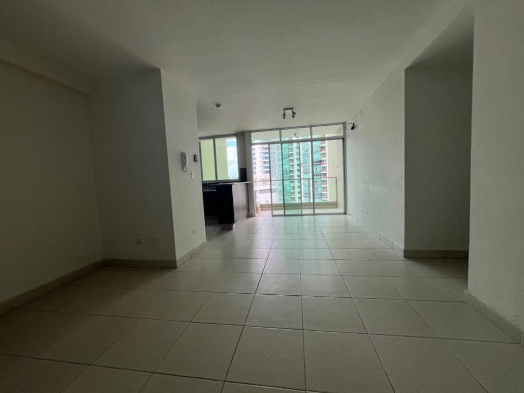 Swimming pool with city skyline views surrounded by sundeck and palm trees at PH Green Bay Costa del Este Panama