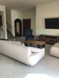 Open plan living dining room stylish furnishings garden views Coronado beach rental Panama