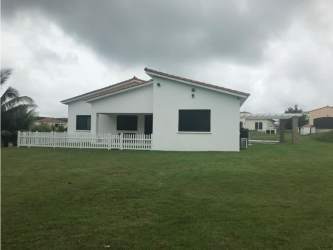 Single-level white house with red tile roof Mediterranean style Hacienda Pacifica Panama
