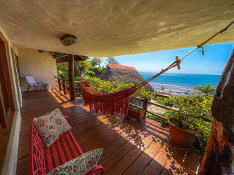 Spacious living room with rustic tropical decor in Coronado beachfront villa Panama