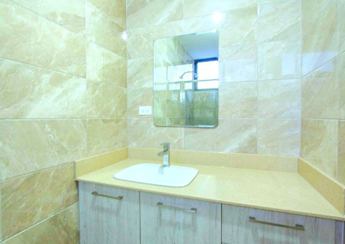 Living room with floor-to-ceiling windows and balcony ocean views in PH Balboa Bay Panama City