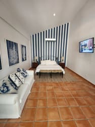 Open plan living dining area vaulted ceiling terrace access stone accents luxury golf estate Coronado Panama