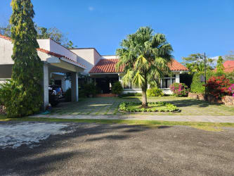 Luxury residence private swimming pool bohío gazebo golf course views lush garden Coronado Golf Beach Resort Panama Oeste