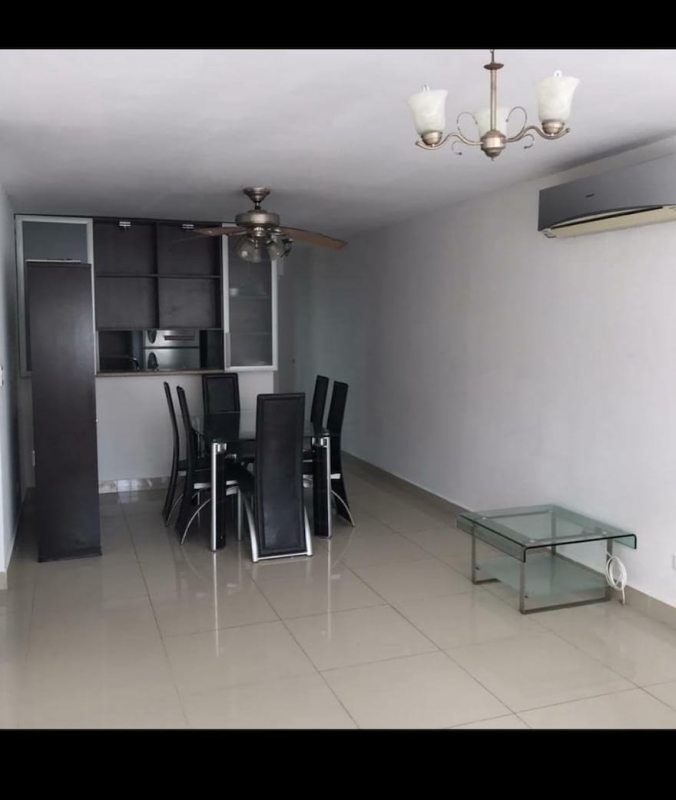 Modern dining space with glass table, AC, ceiling fan near kitchen PH El Marquez Panama City
