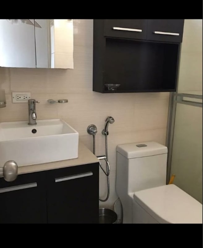 Contemporary bathroom with vanity cabinet, toilet, vessel sink, glass shower in PH El Marquez Panama