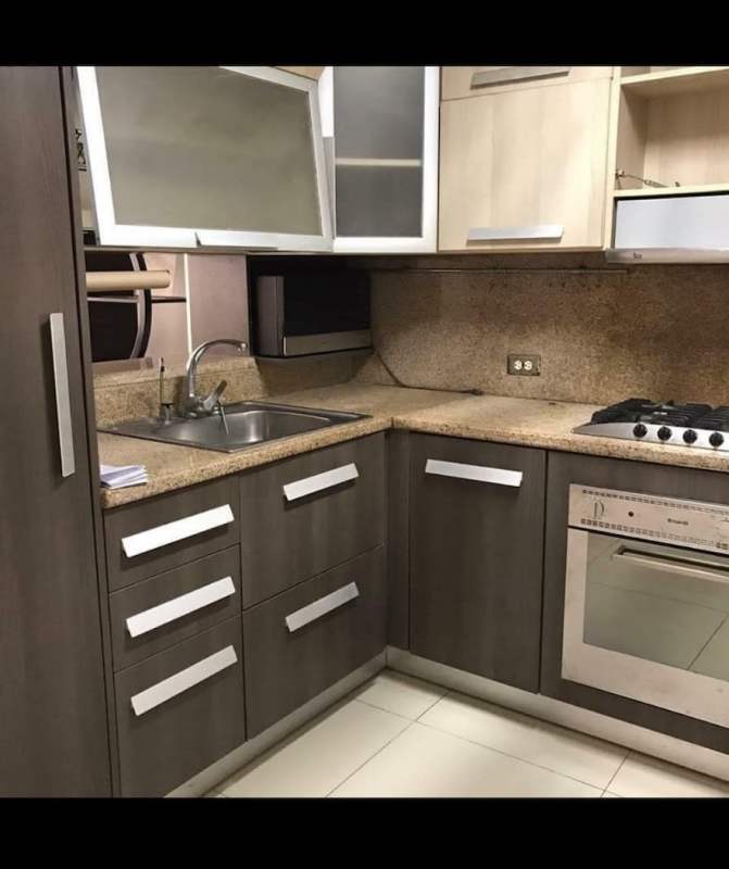 Granite top kitchen with oven, gas stove, sleek cabinetry in PH El Marquez Vista Hermosa Panama