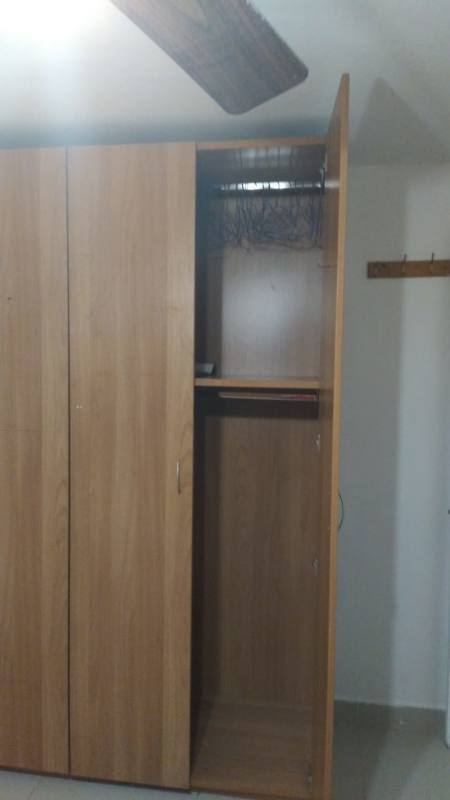 Bedroom with built-in closet space and simple decor in PH El Marquez Panama City