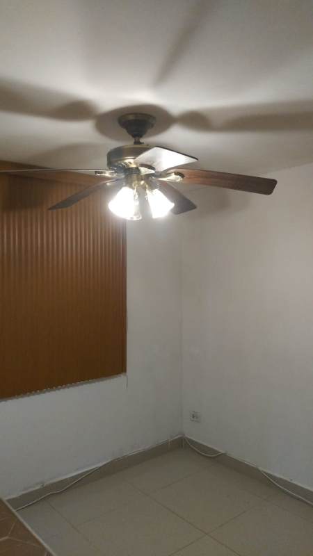 Apartment hallway with frosted glass sliding door, tile flooring in PH El Marquez Panama City