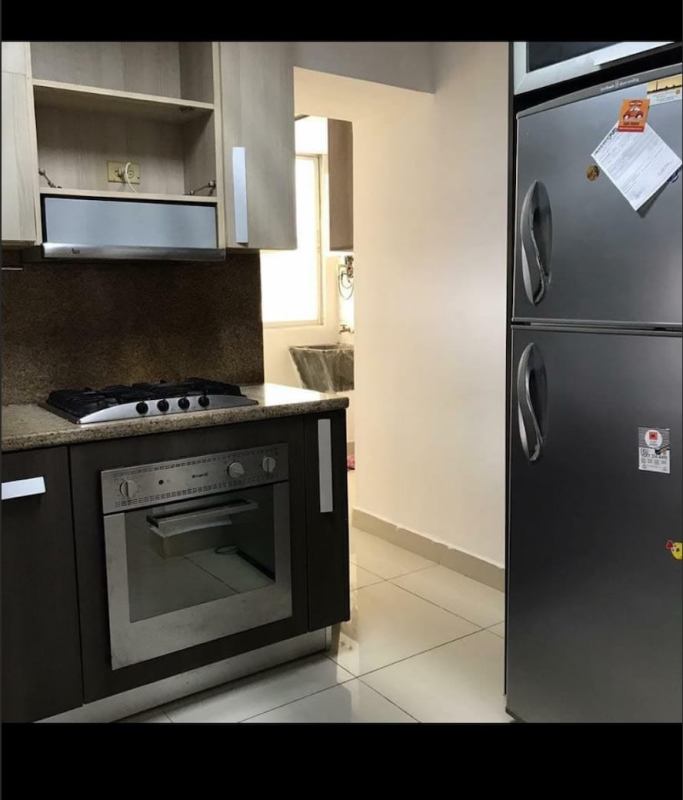 Kitchen with granite counters, built-in oven, gas stove, refrigerator PH El Marquez Panama City