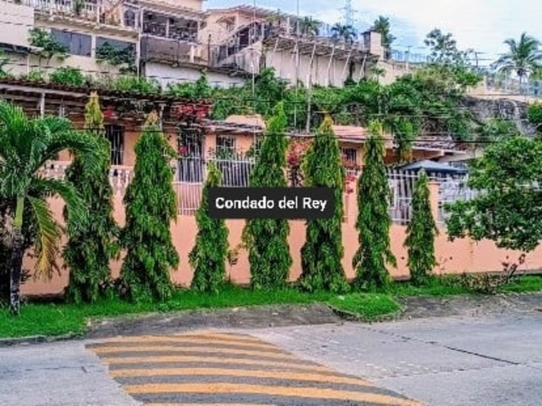 Open plan kitchen dining granite counters white cabinets PH Villa de Vizcaya Condado del Rey