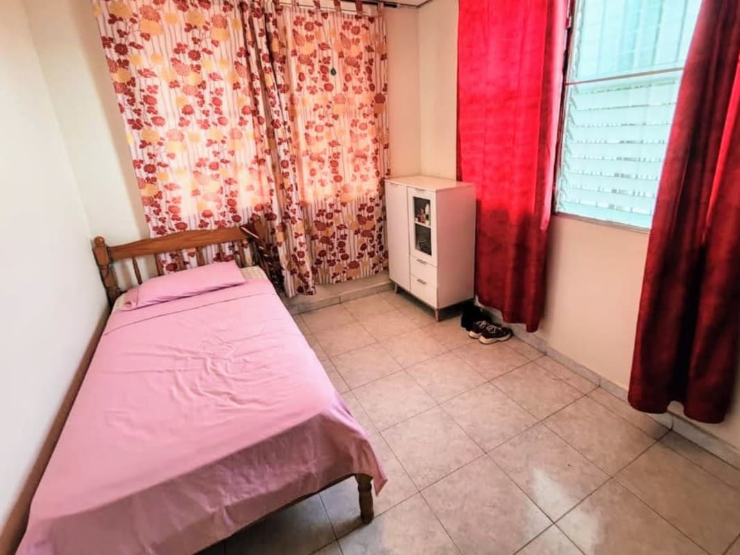 Traditional bedroom with wooden bed ceiling fan built-in closets tiled floor PH Villa de Vizcaya Condado del Rey