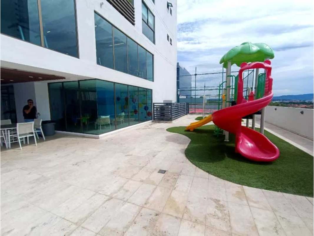 Glass wall and outdoor children’s spiral slide playground in PH Park Lane Costa del Este