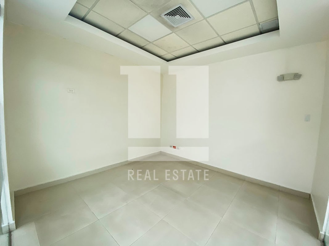 Modern empty office space with drop ceiling, tile floor in PH Beta 120 Bella Vista Panama City