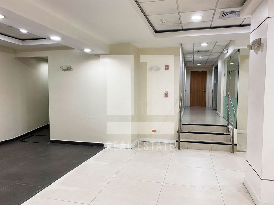 Hallway with glass walls and steel railing modern commercial building PH Beta 120 Panama