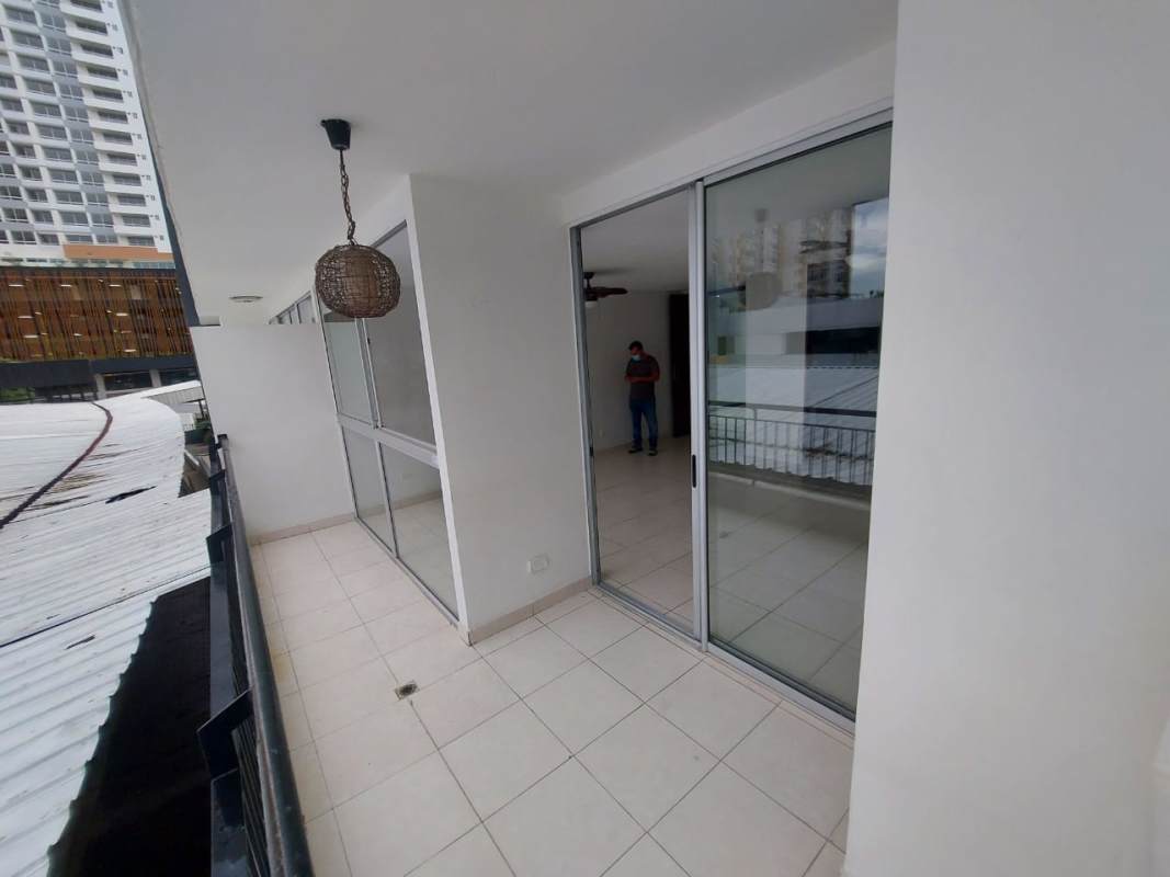 City view from private balcony with glass sliding doors in apartment for rent in El Bosque Panama City