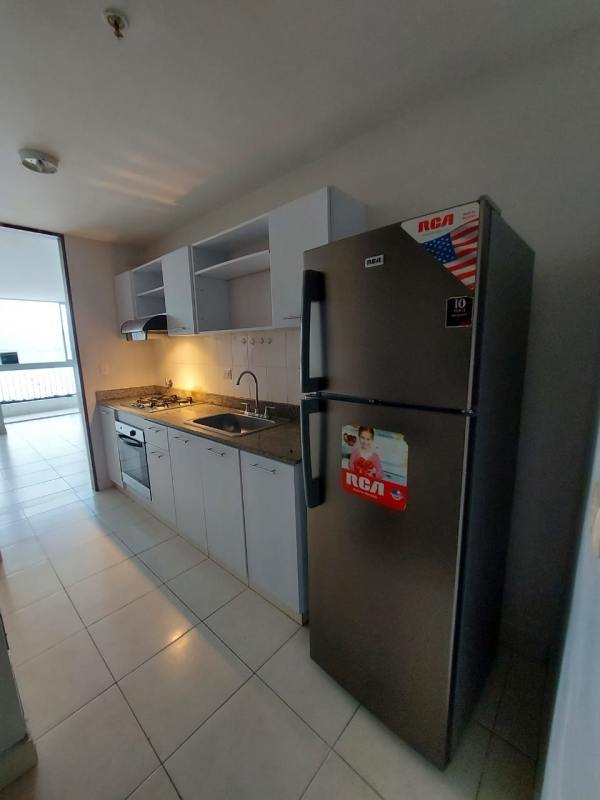 Fully fitted kitchen with granite counters, stove, refrigerator at apartment El Bosque Panama