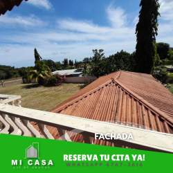Covered terrace with tile floor wooden roof lush greenery Coronado Las Lajas Panama house for sale