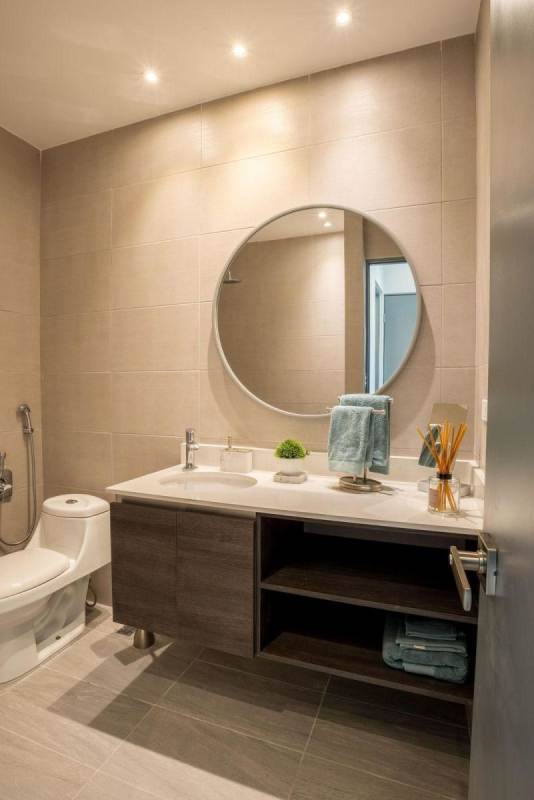 Sleek bathroom with floating vanity and glass shower at PH RISE Panama City
