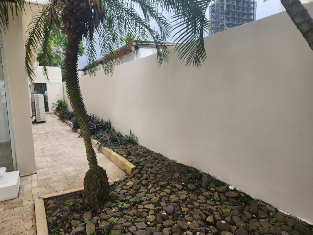 Contemporary bathroom with double sink granite vanity and large mirror in Coco del Mar