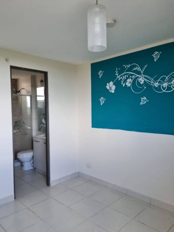 Modern bathroom with glass shower enclosure, vanity sink and ceramic tile at Torres de Cantabria apartment Panama