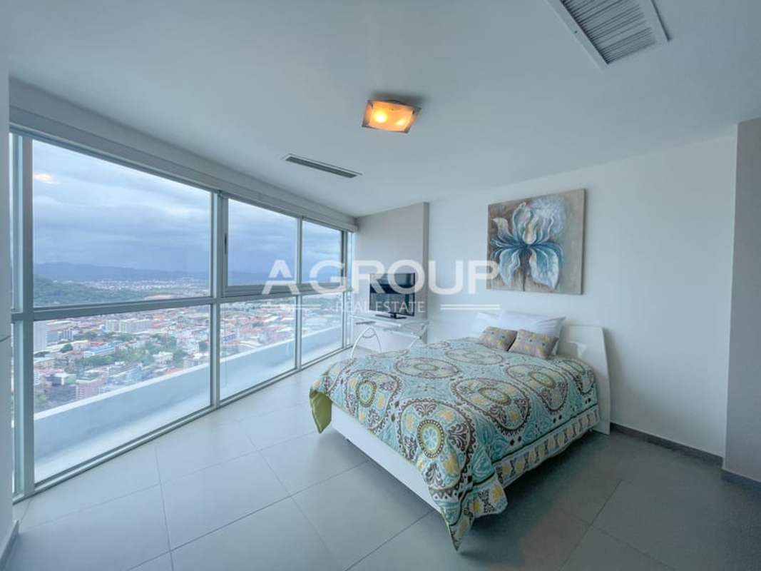 Spacious balcony with glass railings, panoramic view of bay skyline PH Yacht Club Panama City