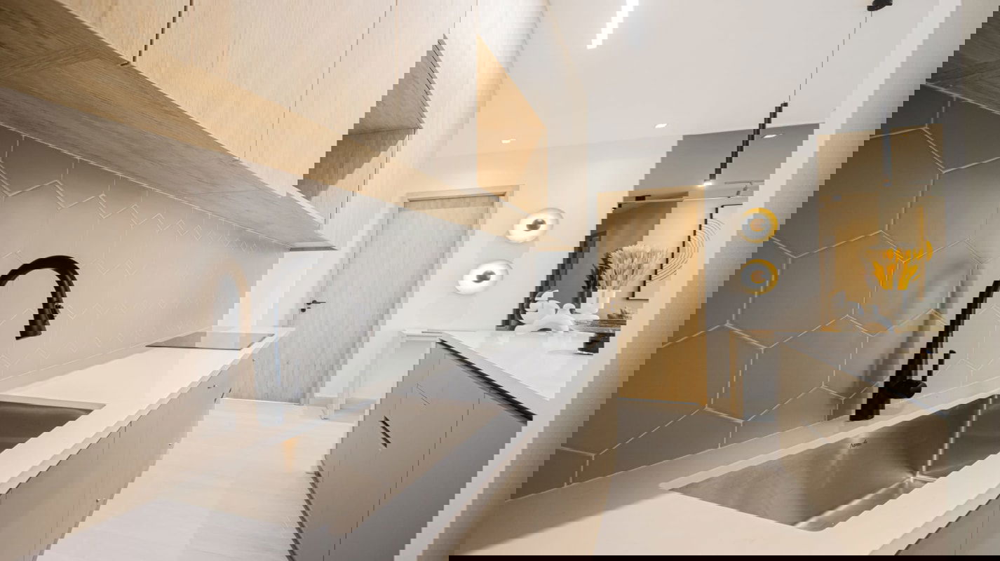 Elegant master bedroom with floor-to-ceiling windows and city ocean views at Nogal Costa del Este Panama