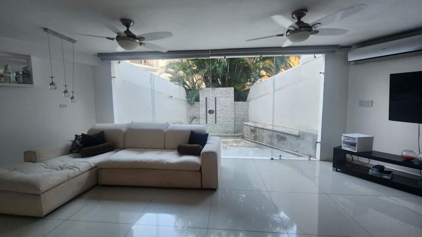 Large modern kitchen with cabinetry, dining space and appliances in luxury home Altos del Golf Panama