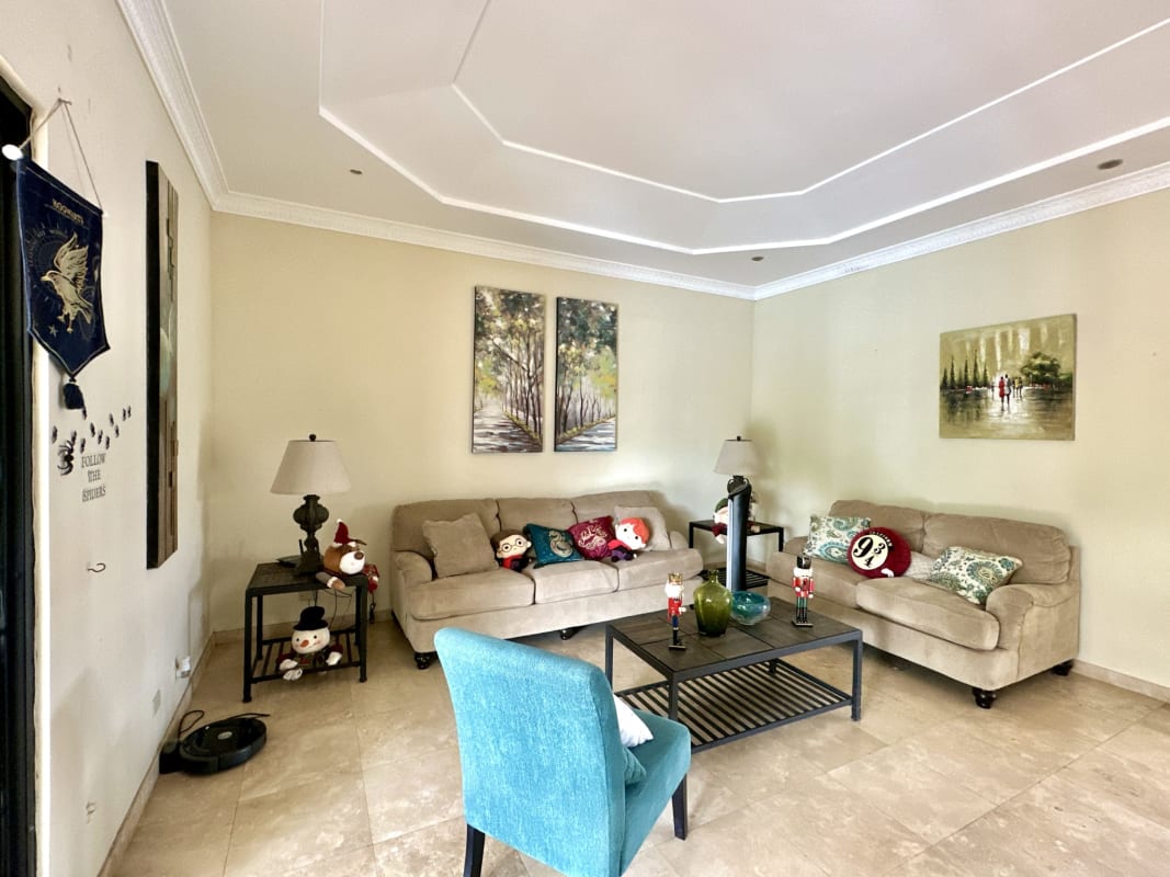 Bedroom with desk workspace, shelving, AC and garden view in Las Cumbres private home Panama