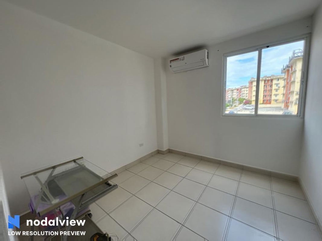 Bedroom with air conditioning, tile floor and large window in PH Villa Lucre Panama