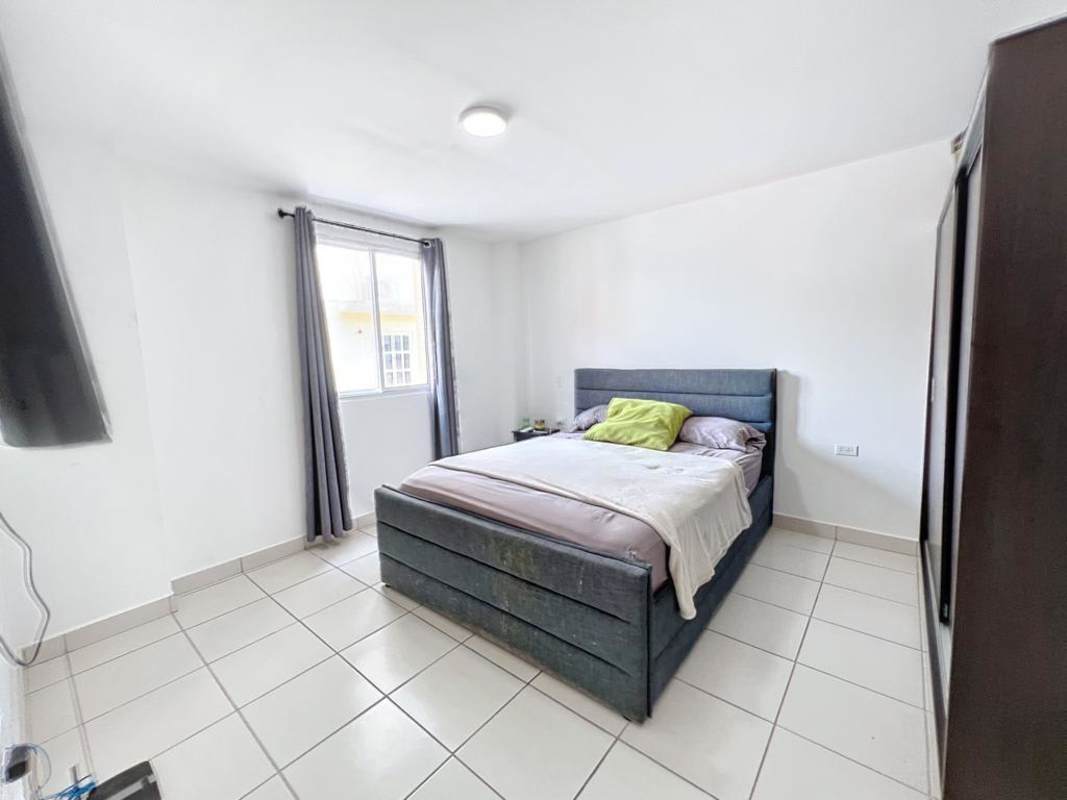 Modern bedroom with wardrobe AC and tile flooring in PH Villa Lucre Panama City