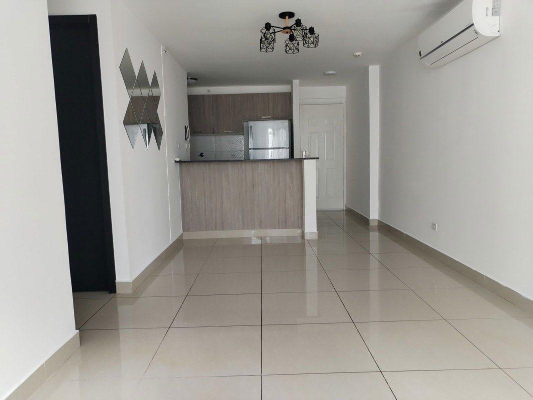 Modern bedroom with AC, large window, city views at PH Coral Towers Panama City