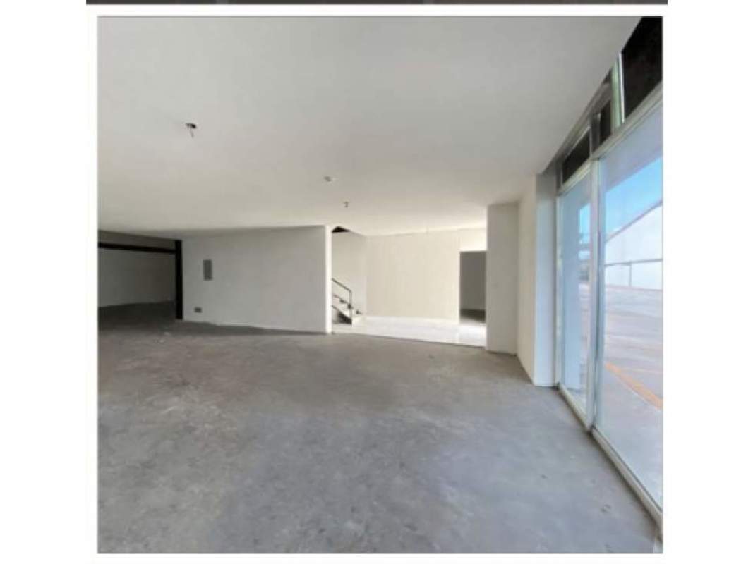 Open plan commercial space warehouse Tocumen Panama with large windows concrete floors staircase
