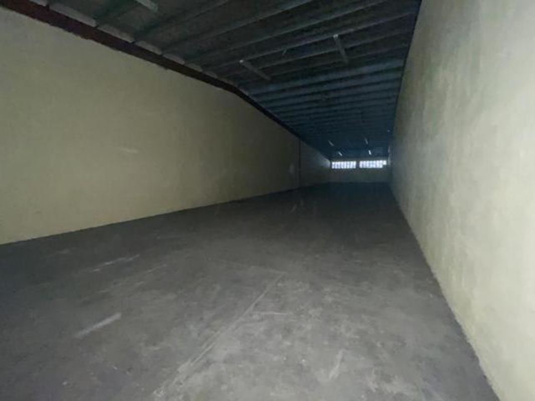 Office space inside commercial warehouse with drop ceiling lights El Crisol Panama