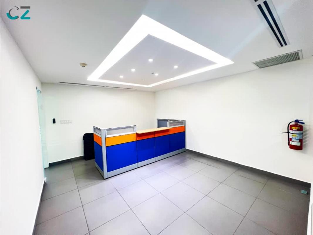 Minimalist reception area with colorful front desk in Oceania Business Plaza Panama City commercial office