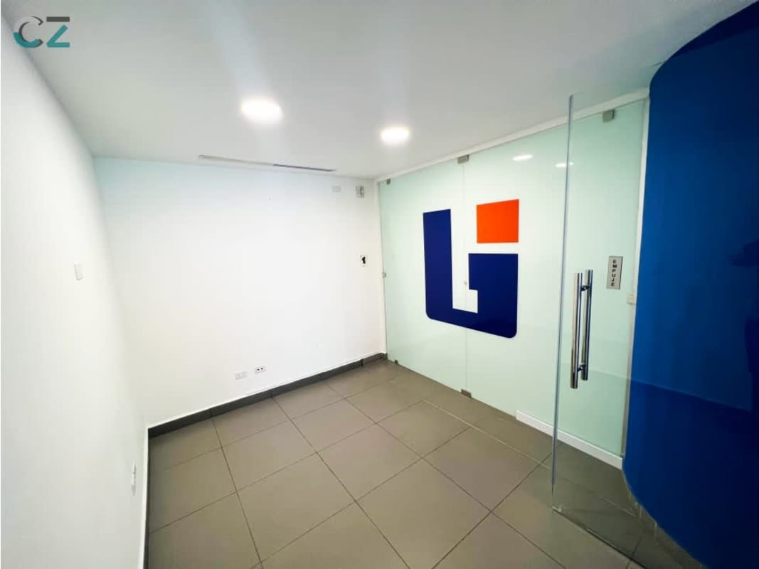 Private office room with glass wall and signage, tiled floor in Oceania Business Plaza Panama